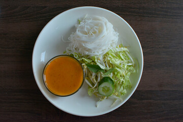 The food is Chinese desserts and dipping sauces.