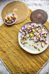 flatlay food photo of colorful fresh salad on yellow and white textile mat