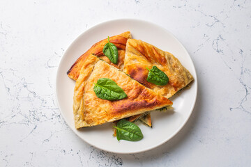 Spanakopita, greek phyllo pastry pie with spinach and feta cheese filling. Delicious handmade pies. Turkish name; el acmasi borek