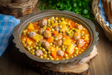 Turkish Food Green Pea Stew with Meatballs - Kofte or Kofta Bezelye. (Turkish name; kofteli bezelye)