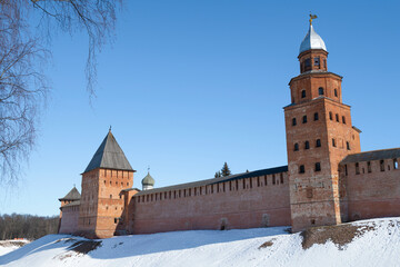 View of Pokrovskaya tower and Kokui tower of Veliky Novgorod Kremlin on sunny March day. Russia