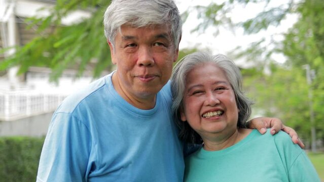 Asian elderly couple happy smile Exercise together in the morning. Sport concept, healthy exercise in retirement age. family exercise