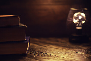 Book on a wooden table background with copy space. Historical atmosphere. Vintage english style. Evidence searching concept. Empty place for text.