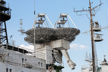 Satellite antenna on the upper deck of a navy ship