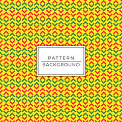 Green and red marks on yellow background in seamless pattern