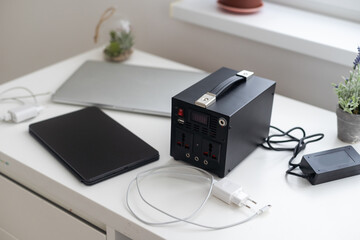 Charging station for phone, tablet, laptop and other gadgets when there is no light during...