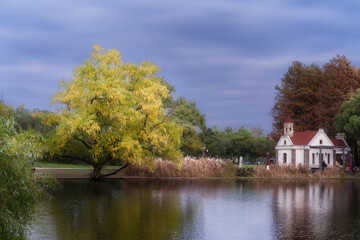 Naklejka na ściany i meble autumn landscape with lake and trees