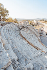 Fototapeta na wymiar Patara (Pttra). Ruins of the ancient Lycian city Patara. Amphi-theatre and the assembly hall of Lycia public. Patara was at the Lycia (Lycian) League's capital. Patara ancient city. Antalya, TURKEY