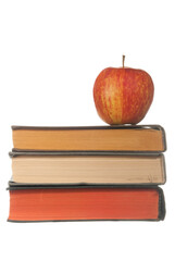 Books and red apple