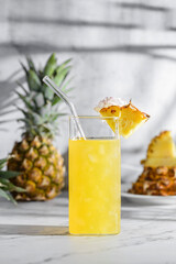 pineapple juice on a gray background