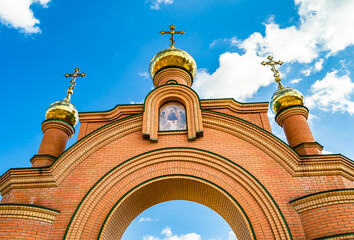 Christian church cross in high steeple tower for prayer