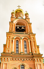 Christian church cross in high steeple tower for prayer