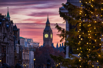 Beautiful sunset view of the Big Ben Clocktower in London, England, during winter time with the...