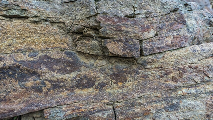 Texture of gray stone. Andesite cracked rock