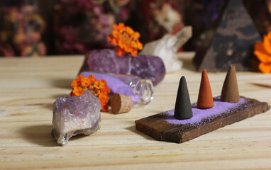 Incense Cones on Stone Slab With Crystals and Flowers