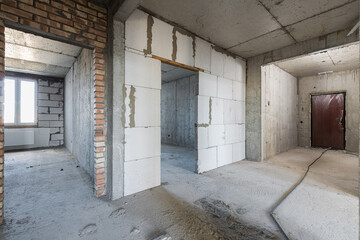 Empty concrete commercial space without finishing with partitions