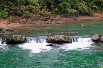 A beautiful emerald green stream In the middle of the valley, Taiwan
