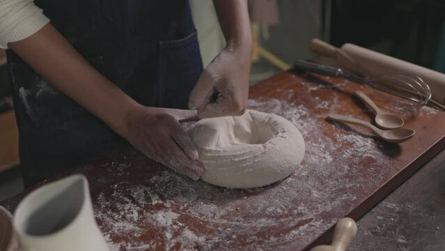 Close up Hands of Women thresh dough at home, enjoying hobby