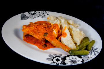 Paprika rabbit stew with noodles on a plate