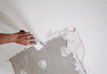 Hand repair water damaged drywall ceiling. 3
