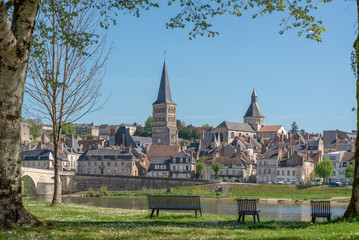 The steeple and the church of the Priory of La-Charité-sur-Loire, France, seen from an island across one branch of the Loire River