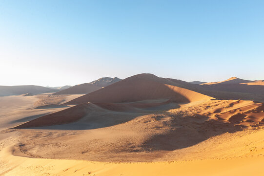 Exterior shot of the Namibian Sossusvlei sanddunes near the famous Dune 45 around sunrise © Goldilock Project