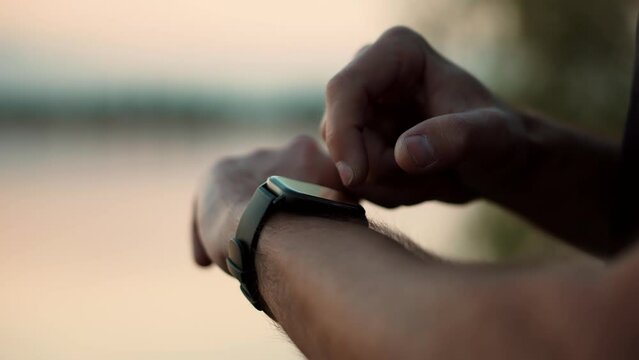 male checking pulse on smartwatch App