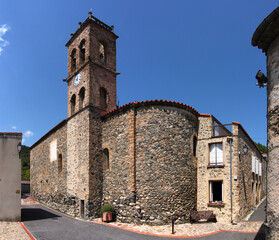 Fototapeta na wymiar Medieval village church with romanesque bell tower in Pézilla-de-Conflent , Occitanie region in France