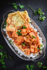 Delicious fish curry with naan bread