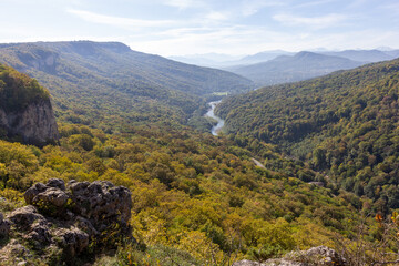 the beginning of autumn, nature walks, a mountain river with waterfalls and a panoramic view of the mountains, hiking trails and recreation in the mountains.*