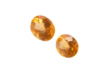 Natural spessartine garnet gemstone isolated on white background