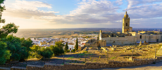 Sunset panoramic view of the pretty village of white houses and medieval church of Medina Sidonia in Cadiz, Spain.