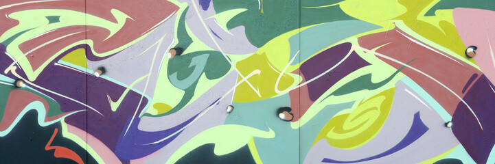 Colorful background of graffiti painting artwork with bright aerosol strips on metal wall. Old school street art piece made with aerosol spray paint cans. Contemporary youth culture backdrop