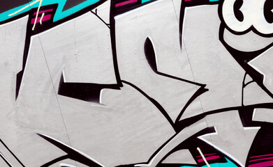 Colorful background of graffiti painting artwork with bright aerosol strips on metal wall. Old...