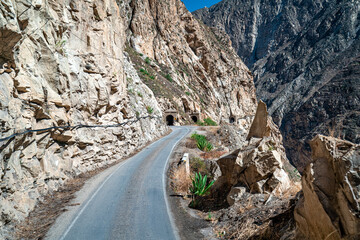 a road in the mountains carved in the rock