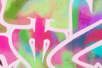 Colorful background of graffiti painting artwork with bright aerosol strips on metal wall. Old...