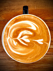 cup of coffee on wooden table