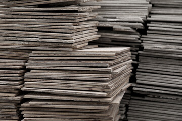 Stacks of ceramic tiles as background, closeup