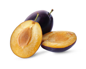 Whole and cut ripe plums on white background