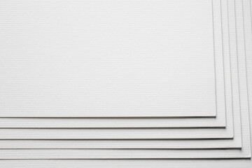 Stack of white paper sheets as background, closeup