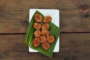 Delicious fried bananas on wooden table, top view