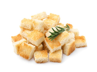 Delicious crispy croutons with rosemary on white background