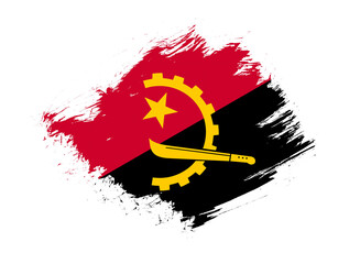 Angola flag with abstract paint brush texture effect on white background