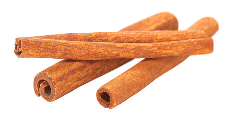 cinnamon sticks lie on a white background
