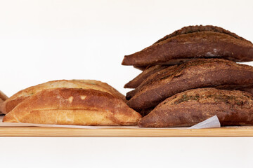 fresh bread on the shelf, cooked bread dark and white