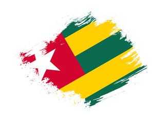 Togo flag with abstract paint brush texture effect on white background