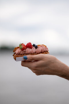 Person Holding A Lot Of Sweets