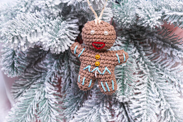 Creative diy craft hobby. Making handmade craft christmas ornaments and balls with felt spruce tree. christmas tree with colorful balls and gift boxes over white brick wall with blue and white balls