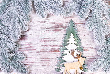 Christmas composition with beautiful decoration, christmas tree and wreath, deer, gifts and accessories in modern home decor.