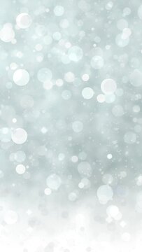 Abstract glitter lights silver background. Seamless looping video footage. (018_Silver_vertical)